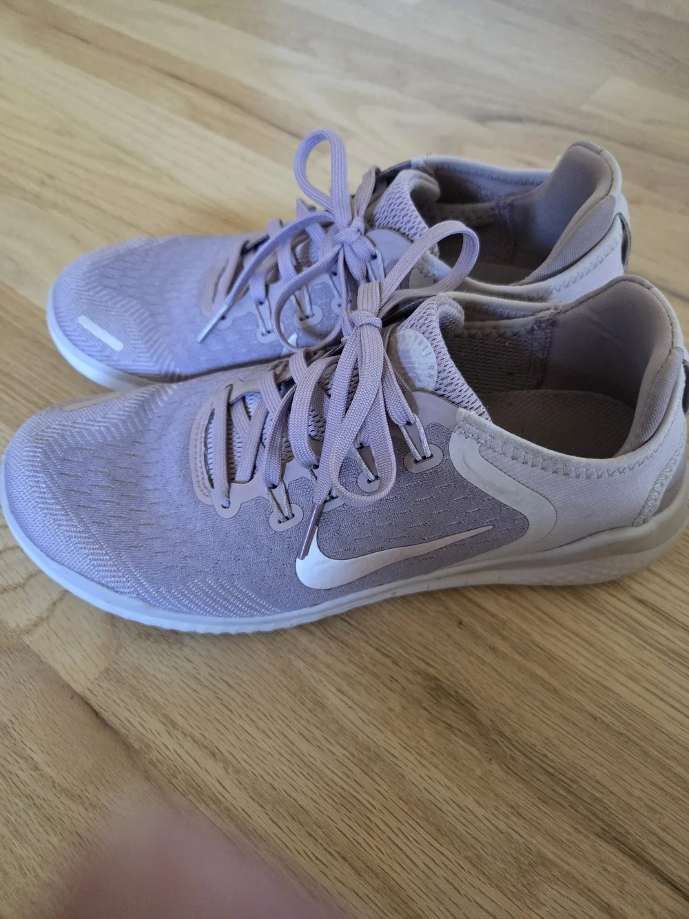 Nike Women's Pink Lilac Athletic Running Sneakers with White Swoosh